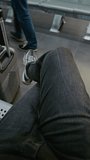 Crowded International Airport Terminal: POV First-Person View of Traveler with Suitcase, Passport and Boarding Pass Sitting in Departure Lounge, Then Walking to Boarding Gate for Flight. Vertical Shot - Powered by Shutterstock - Get 15% off with code: PIKWIZARD15