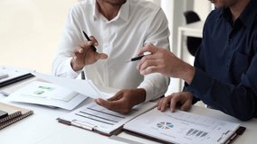 Two Business man team meeting present, investor colleagues discussing new plan financial graph data, analysis with laptop and digital tablet at work place - Powered by Shutterstock - Get 15% off with code: PIKWIZARD15