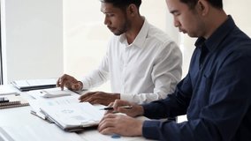 Two Business man team meeting present, investor colleagues discussing new plan financial graph data, analysis with laptop and digital tablet at work place - Powered by Shutterstock - Get 15% off with code: PIKWIZARD15