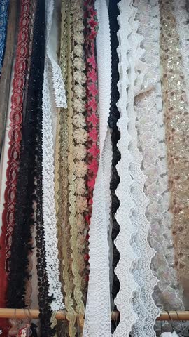 Brocade and lace in a tiny stall at the market