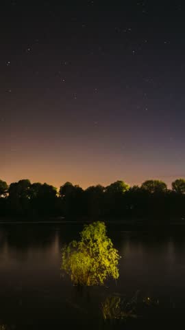 Star Trails On Night Sky Background. Amazing Starry Effects. Star Lines Move In Sky. Timelapse Night Sky Above River. From Dusk To Dawn. Night Sky Turns Into Morning. Dawn Is Coming. Time Lapse Time