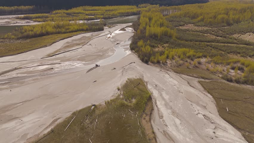 Aerial View of Glacial River Flowing Through a Valley in British Columbia, Canada