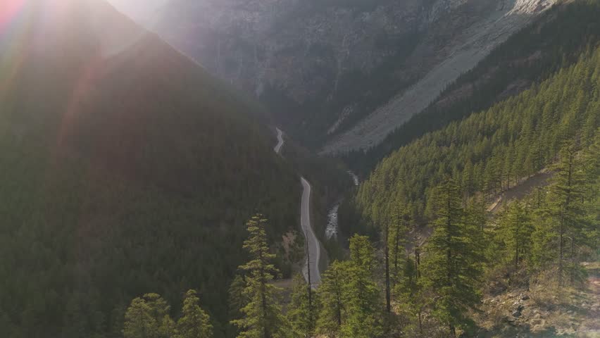 Aerial View of Scenic Mountain Road Through Valley in British Columbia, Canada