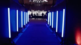 Corridor with blue neon lights leading to stage - Powered by Shutterstock - Get 15% off with code: PIKWIZARD15