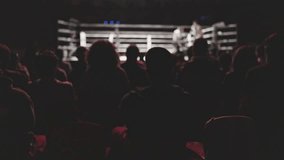 Spectators watch a boxing match from the stands - Powered by Shutterstock - Get 15% off with code: PIKWIZARD15