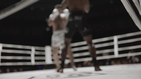 Corner post view of muay thai fighters exchanging punches and kicks - Powered by Shutterstock - Get 15% off with code: PIKWIZARD15