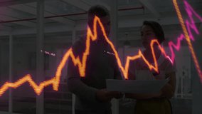 Two colleagues holding laptop reviewing stock market data while digital line charts overlay office. Business, teamwork, analytics, innovation, corporate, technology, collaboration - Powered by Shutterstock - Get 15% off with code: PIKWIZARD15