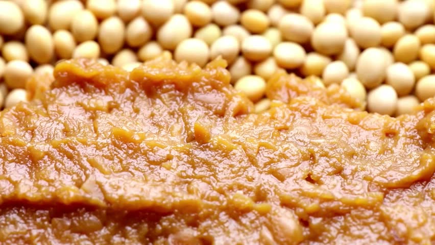 Close-up of Miso Paste with Soybeans Background