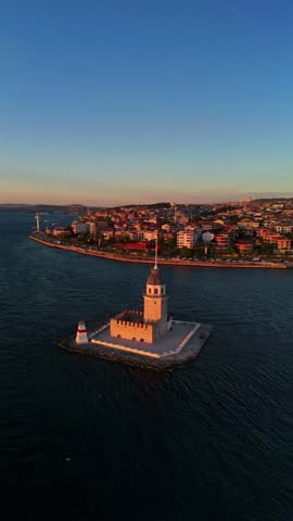 Maiden Tower 4K ULTRA HD video Stunning Aerial View of  in Istanbul at Sunset. An aerial shot of the Maiden's Tower (Kız Kulesi) in Istanbul, Turkey, Drone shot vertical shot framing approaching tower