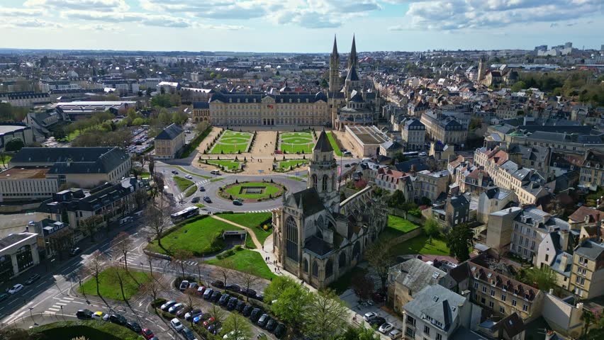 Caen town hall, historic Eglise Saint-Étienne-le-Vieux church ruins, Abbaye aux Hommes or Abbey men, cityscape, France. Aerial forward