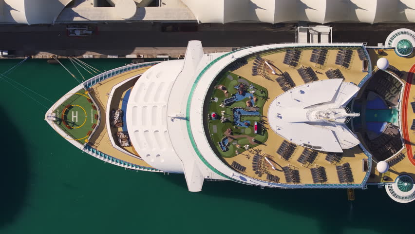 Port of Miami, Miami, Florida, USA - JANUARY 25, 2025: Watch breathtaking aerial views of a majestic cruise ship docked in Miamis vibrant Port, highlighting the beautiful Downtown skyline