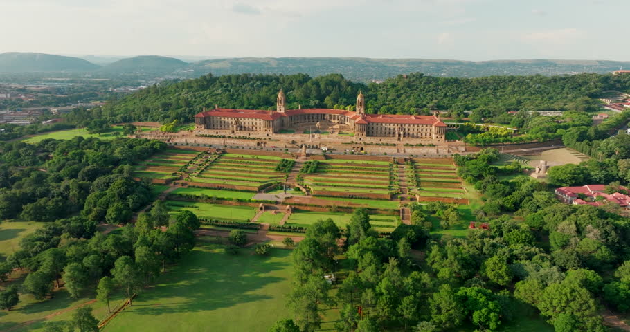 Establishing shot of Union Buildings in Pretoria city, South Africa, with gardens landscape. Stunning views of historic architecture and government office. 4K drone wide orbit footage