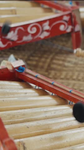Traditional thai alto xylophone being played with mallets