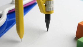 Drawing with compasses and other school supplies - Powered by Shutterstock - Get 15% off with code: PIKWIZARD15