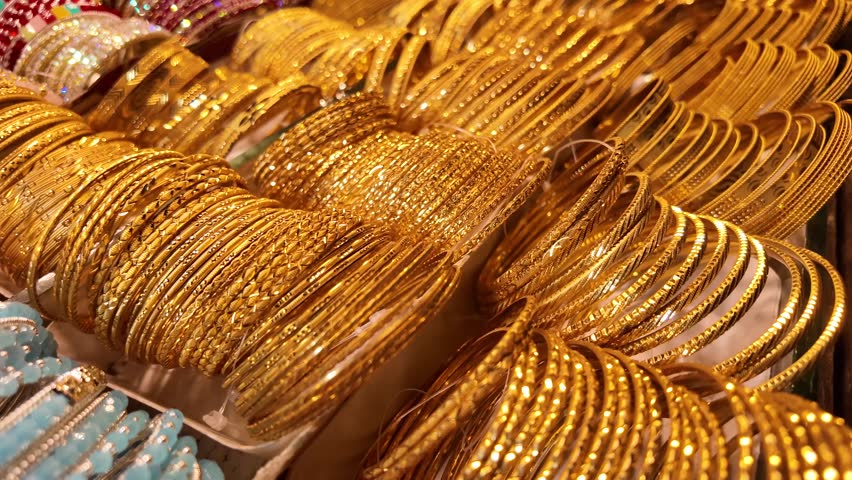 A Vibrant and Colorful Display of Gold Bangles at the Jewelry Store