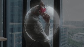 Man wearing red mask at window, viewing wireframe globe and technology icons floating. Professional, innovation, futuristic, corporate, connectivity, digital, architecture - Powered by Shutterstock - Get 15% off with code: PIKWIZARD15