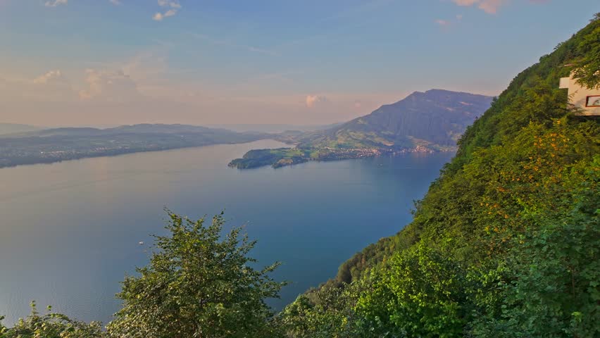 A scenic view of Lake Lucerne from Burgenstock mountain, Switzerland, at sunset.
