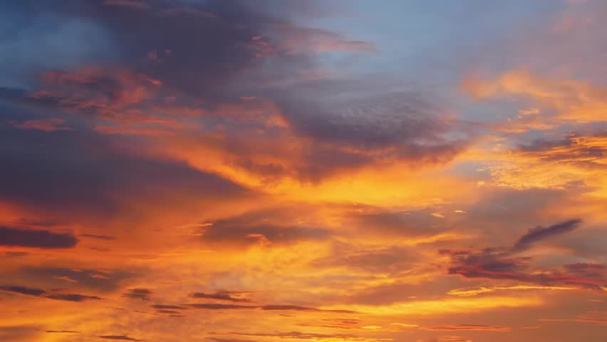 Crimson Clouds: Captivating a dramatic sunset spectacle, showcasing fiery hues dancing across the atmospheric canvas