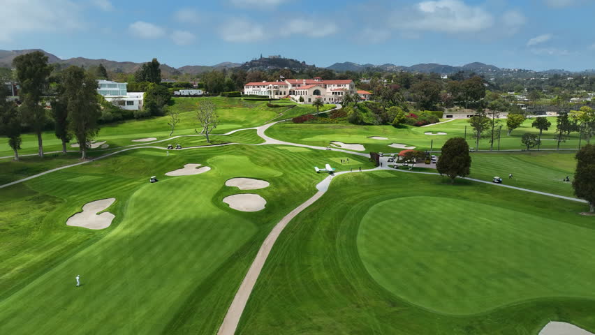 Aerial view of a plane emergency landed on a golf course in sunny Los Angeles,