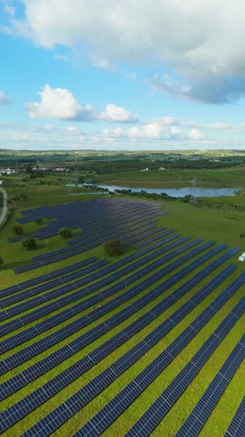 Photovoltaic Solar Panels on Sunny Day in Alentejo, Portugal. Aerial View. Moving Backwards. Vertical Video
