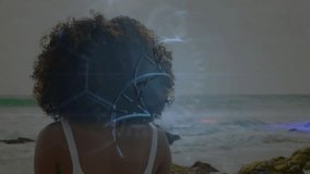 woman standing on rocky shoreline, exploring biotech using holographic DNA helix and data interface. Futuristic, technology, innovation, marine, data visualization, scientific, exploration - Powered by Shutterstock - Get 15% off with code: PIKWIZARD15