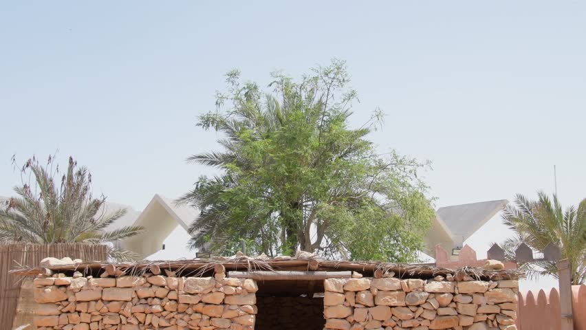 Emirates heritage village display of traditional stone house in Abu dhabi, UAE. Tilt down view