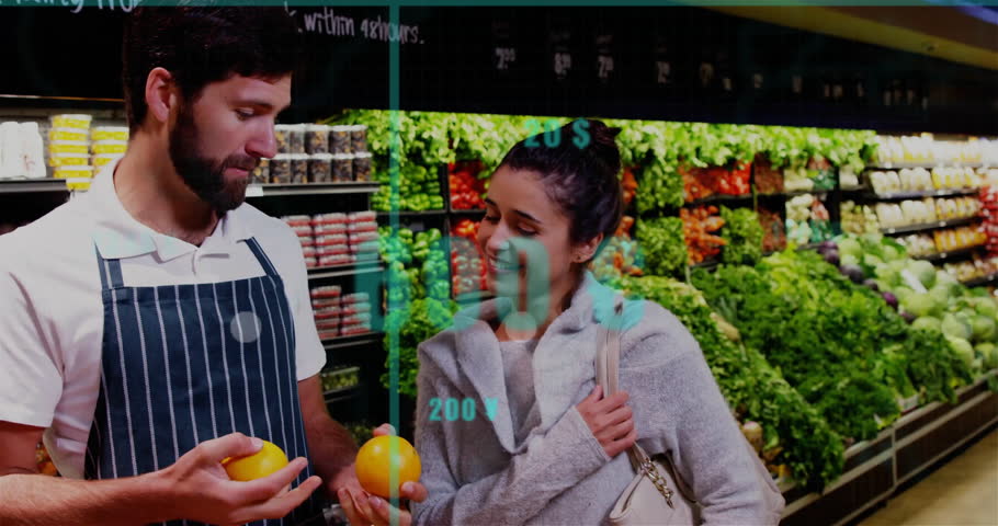 Store clerk and shopper examining orange in grocery produce aisle showing bar graphs and price tags. Retail, commerce, analytics, health, freshness, consumer, digital
