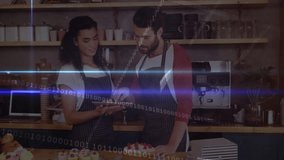 Two baristas boosting coffee business by reviewing sales data on tablet, showing binary overlay. Cafe, baristas, digital, innovation, modern, teamwork, hospitality - Powered by Shutterstock - Get 15% off with code: PIKWIZARD15