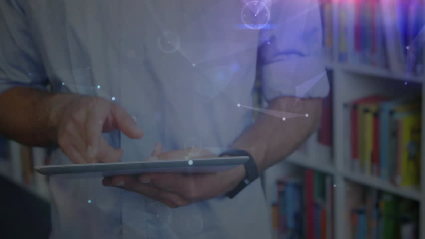 man handling tablet in library, displaying holographic network nodes for education technology. Technology, innovation, futurism, digital, workspace, professional, modern