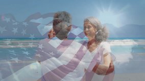 Senior couple spinning on sandy beach, showcasing marketing graphic American flag overlay. Romance, celebration, outdoor, travel, carefree, vitality, joyful - Powered by Shutterstock - Get 15% off with code: PIKWIZARD15