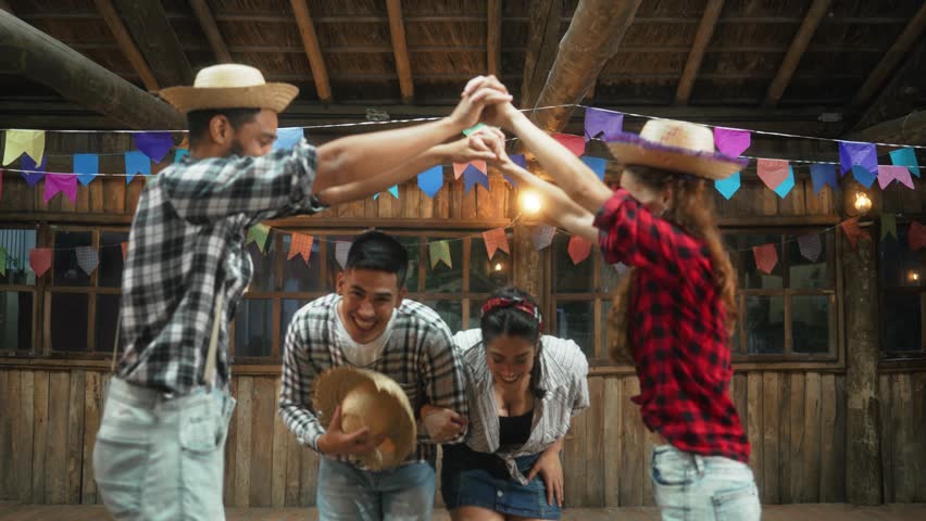 Joyous Partners Engaging in Festive Dance at Rustic Celebration. Smiling Couple Performing Traditional Steps at Brazilian Cultural Event
