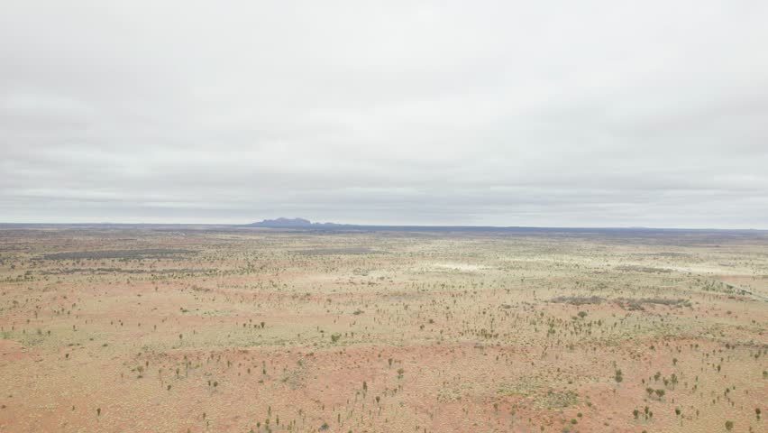 Vast Red Sandy Plain At Uluru-Kata Tjuta National Park In The Northern Territory Of Australia. Aerial Wide Shot