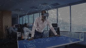 Standing man using VR headset manipulating 3D truck on table in office, displaying data overlays. Technology, collaboration, innovation, digital, futuristic, workspace, networking - Powered by Shutterstock - Get 15% off with code: PIKWIZARD15