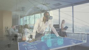 Male engineer using VR headset leaning on digital table in studio, overlaying network graphics. Technology, collaboration, innovation, futuristic, office, digital, workspace - Powered by Shutterstock - Get 15% off with code: PIKWIZARD15