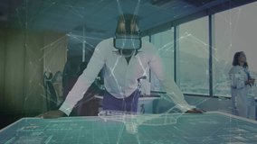 mature man wearing VR leaning over desk in tech lab, projecting holographic airplane blueprint. Futuristic, innovation, collaboration, technology, urban, high-tech, creative - Powered by Shutterstock - Get 15% off with code: PIKWIZARD15