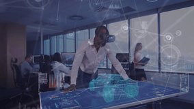 technology executive standing at digital table, interacting with holographic car model and charts. Futuristic, innovation, collaboration, digital, workspace, professional, visualization - Powered by Shutterstock - Get 15% off with code: PIKWIZARD15