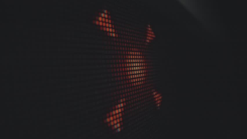 A detailed close up image of a digital screen displaying abstract orange patterns on a grid, creating a modern, pixelated art effect. Macro