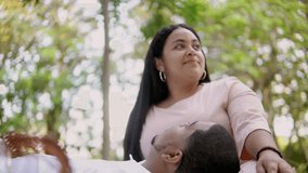 Interracial couple enjoying a picnic in a park, showing love and connection - Powered by Shutterstock - Get 15% off with code: PIKWIZARD15