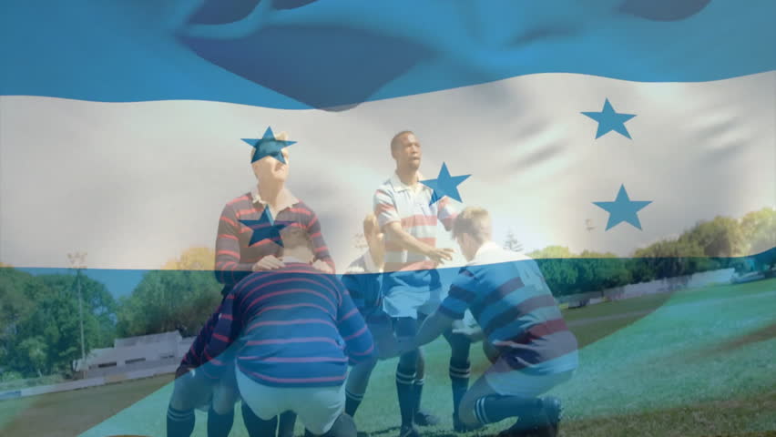 Six players lifting teammates in sports lineout on grass, showing floating rugby ball and flag. Athletic, teamwork, competition, victory, strategy, outdoor, dynamic