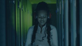 Female IT technician inspecting server racks in data center, showing animated encrypted code bar. Technology, cybersecurity, innovation, digital, professional, futuristic, industrial - Powered by Shutterstock - Get 15% off with code: PIKWIZARD15