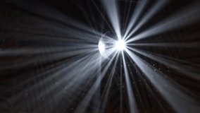 Disco ball with reflected moving rays rotating at nightclub. Searchlight illuminates of spinning mirror disco ball, white light reflection on walls and ceiling. Party celebration concept - Powered by Shutterstock - Get 15% off with code: PIKWIZARD15