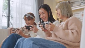 Asian family with smartphone game online technology Grandmother learning new technologies with granddaughters using smartphones at home Laughing intergenerational family spending leisure time	 - Powered by Shutterstock - Get 15% off with code: PIKWIZARD15