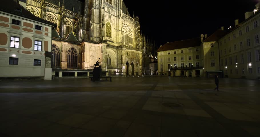 Prague St. Vitus Cathedral gothic church building detailed view at night illuminated in the dark, no people, nobody around in the old town castle area