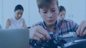 students assembling robotics kit at workbench in tech classroom, with floating social media icons. Stem, education, innovation, collaboration, youth, technology, creativity - Powered by Shutterstock - Get 15% off with code: PIKWIZARD15