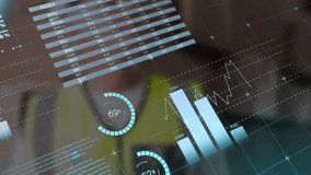 Mature man wearing safety vest using tech interface showing map pie, bar and candlestick charts. Analytics, technology, innovation, dashboard, industrial, data, management - Powered by Shutterstock - Get 15% off with code: PIKWIZARD15