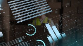 Engineer wearing safety vest monitoring interface in industrial warehouse, showing world map charts. Technology, analytics, data, visualization, industrial, professional, futuristic - Powered by Shutterstock - Get 15% off with code: PIKWIZARD15