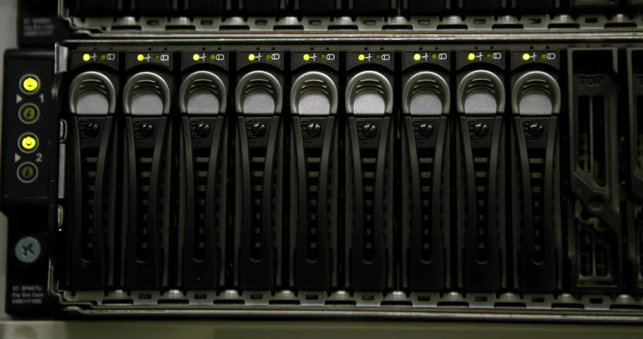 Rack-mounted server drive bay showing hot-swappable trays while code lines projecting across panel. Hardware, data center, technology, cyber security, digital infrastructure, modern, industrial