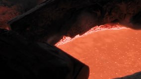 Molten Metal Bubbling Inside Furnace Crucible During Bell Manufacturing Process - Close Up - 4K - Powered by Shutterstock - Get 15% off with code: PIKWIZARD15