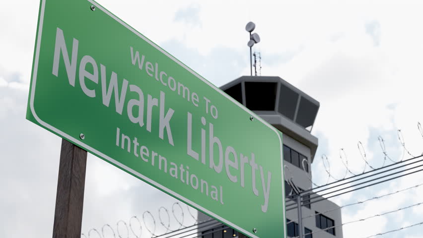 Newark Liberty International Airport Green Road Sign In Front of Air Traffic Control Tower.
