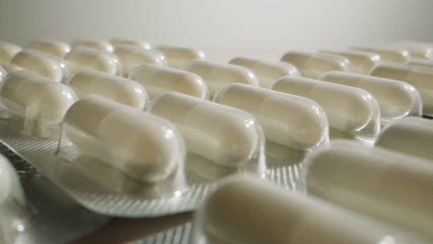 Pills and vitamins macro, Close up view of womans hands holding plenty of different drugs. Painkillers and antibiotics. Healthcare and medicine concept